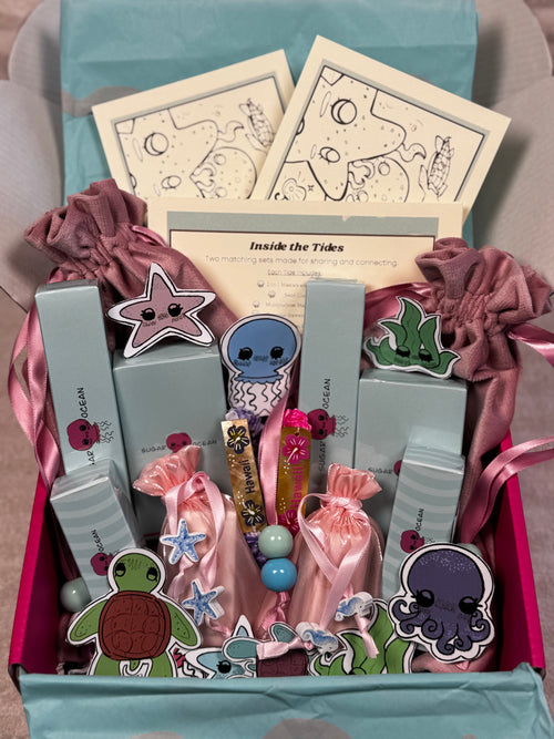 Hawaii makeup brand gift set box with stickers inside a box with velvet pink pouches.